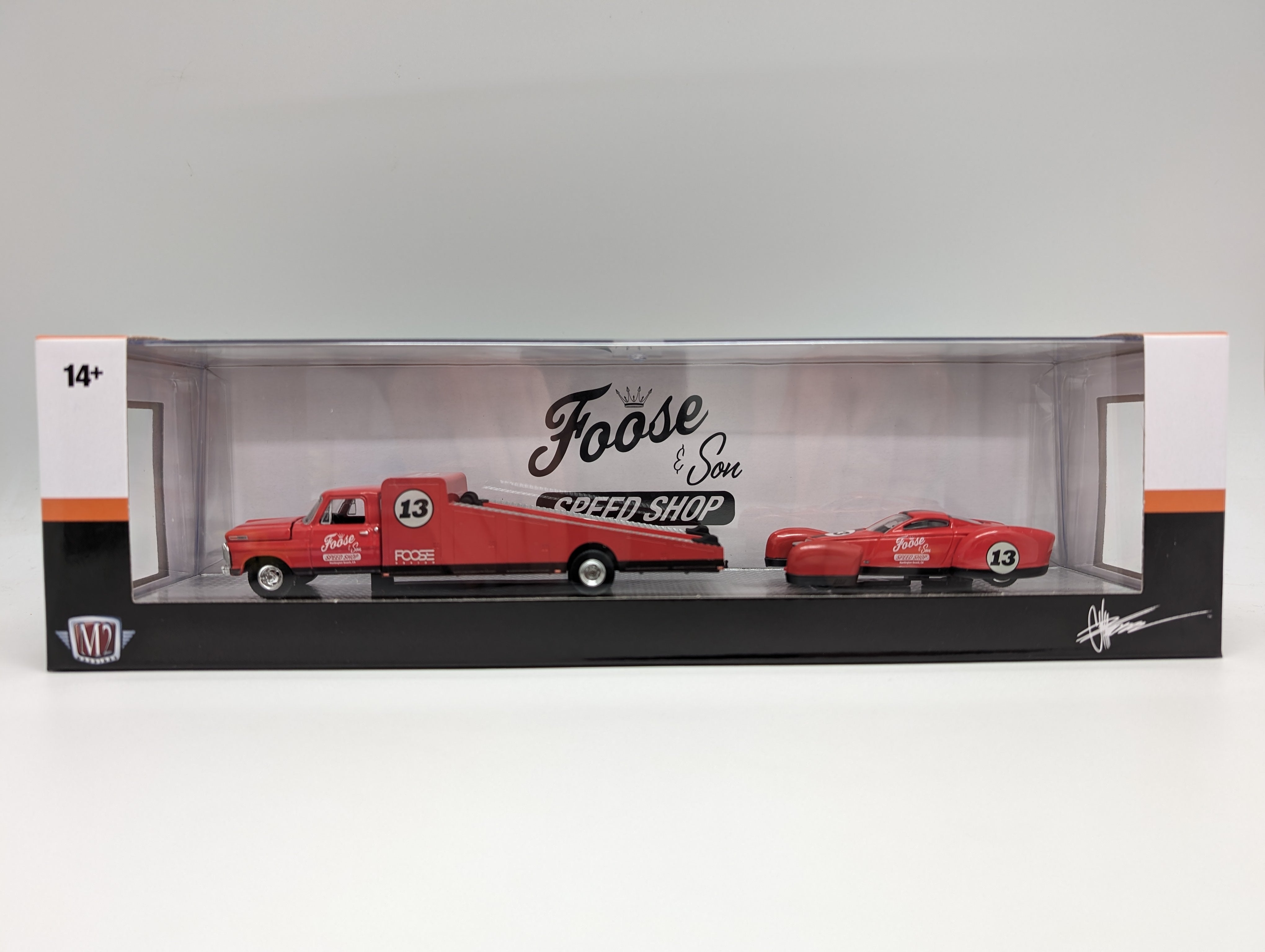 M2 1969 Ford F350 race car hauler with a matching Foose Coupe